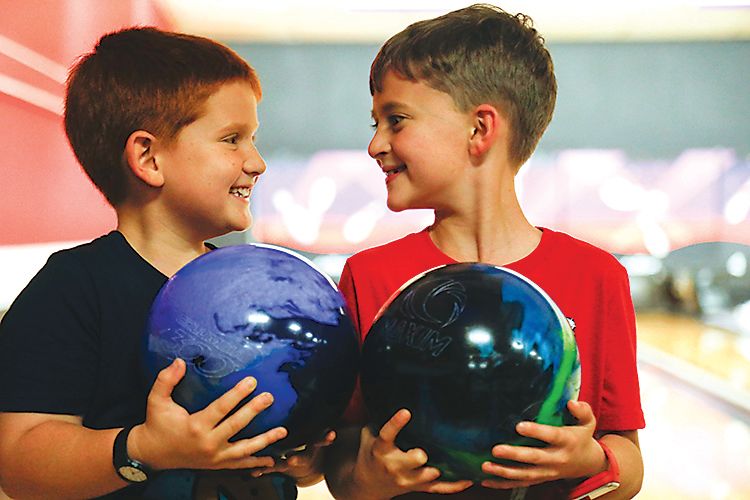 Bowling is a great—and inexpensive—activity for kids.