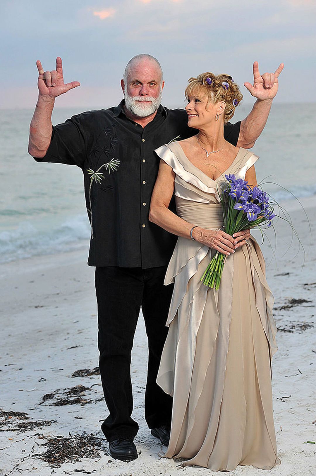 After reconnecting in the early 2000s, Savage and Lynn Payne were married on the same stretch of Lido Beach where they met almost four decades prior.