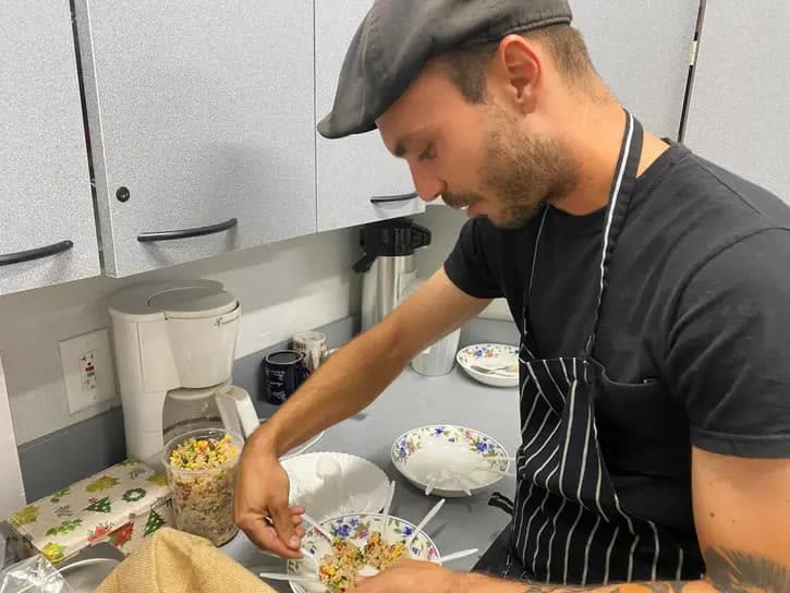 Chef Erik Decker prepares samples for a previous cooking demonstration.