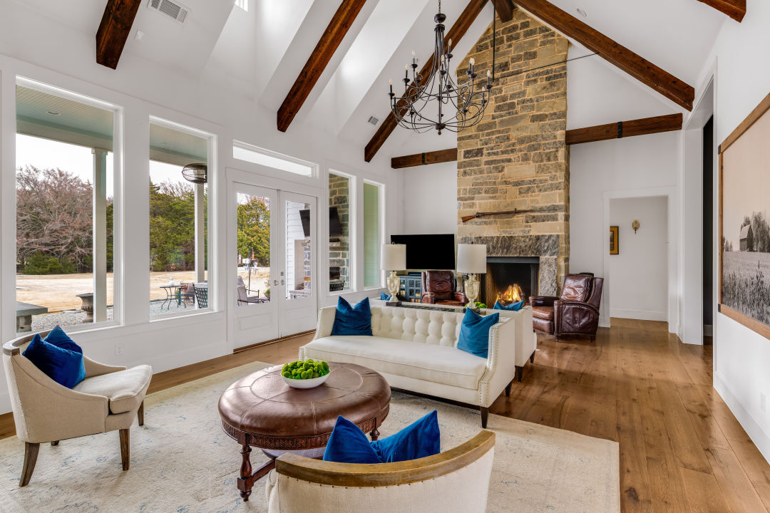 A beautiful living room with vaulted ceiling and lots of natural light