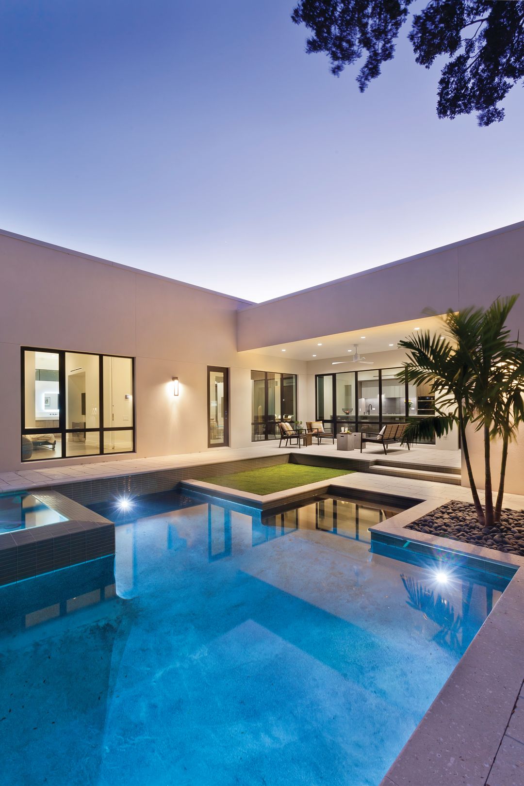 A new, geometric-shaped pool and seating area extend the modern design.