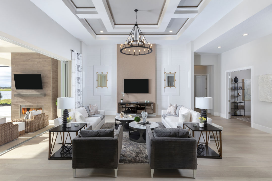 A sitting room with paneled walls and ceiling.