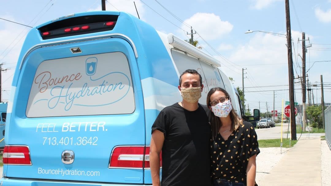 A couple at Boost Hydration, a mobile IV drip spa.
