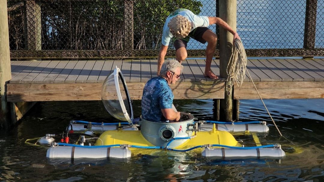 Scott Cassell climbs into Great White, the submarine he built for marine research.