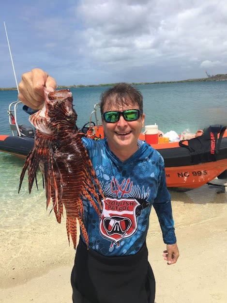 Scott Gonnello with an invasive lionfish