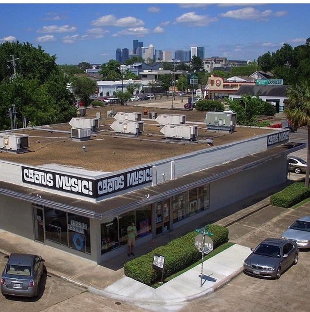 An aerial view of a white building labeled