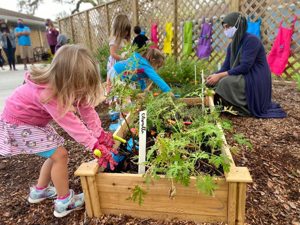 A child plays in The Florida Center for Early Childhood Education's new sensory garden.