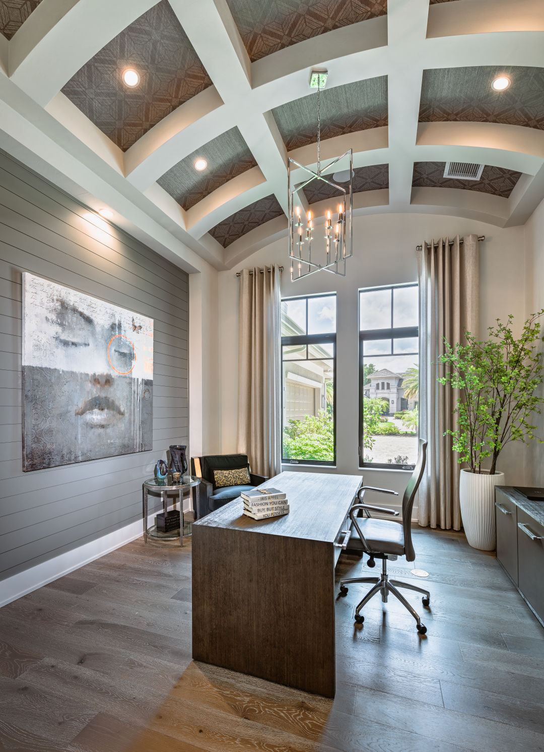 A shiplap wall and ceiling cutouts in a study.