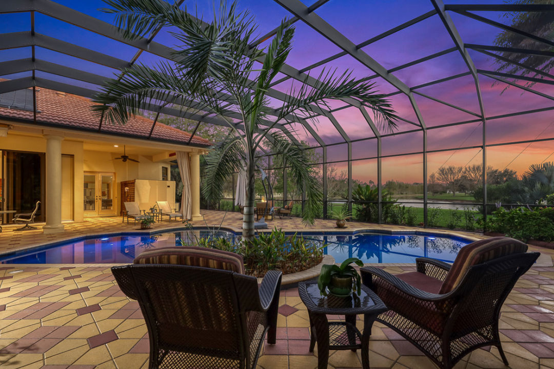 Covered swimming pool and patio at 7590 Preservation Drive