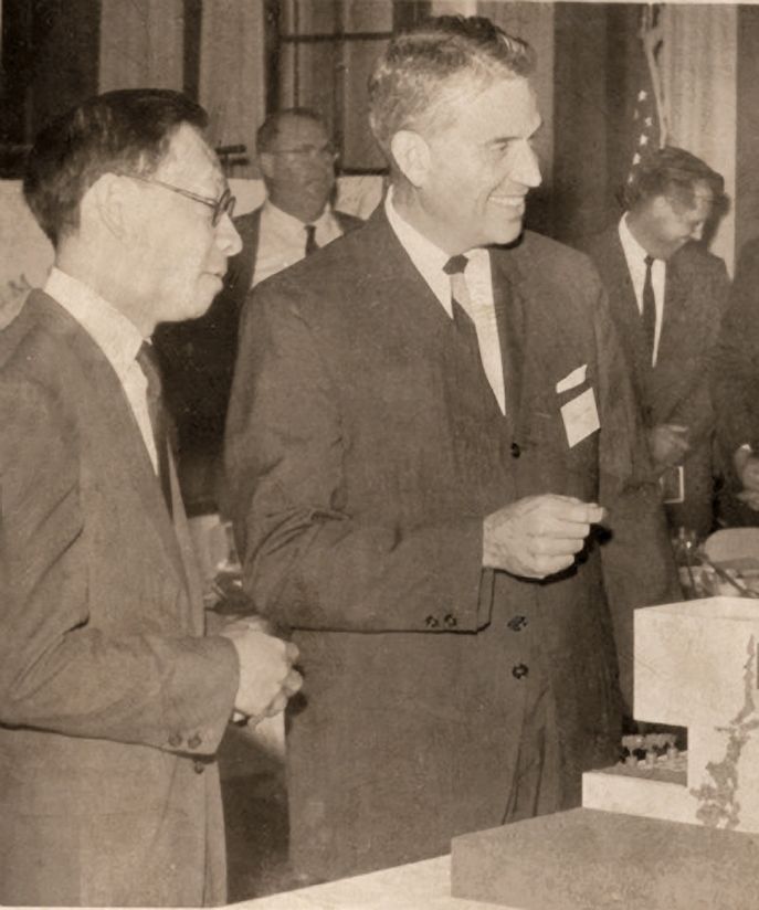 Architect I. M. Pei and New College president George Baughman in front of a model of the Pei-designed residence halls.