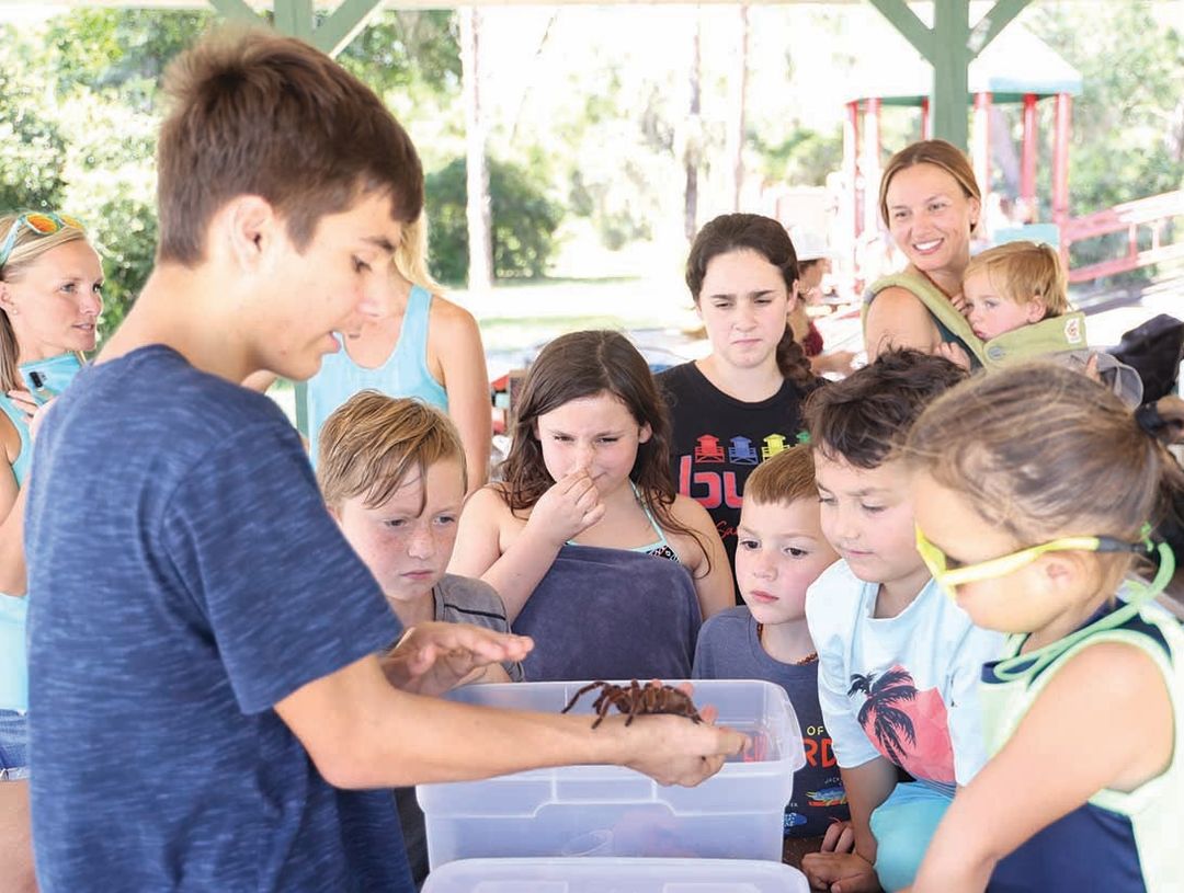 Andrew Pugliese introduces kids to a tarantula.