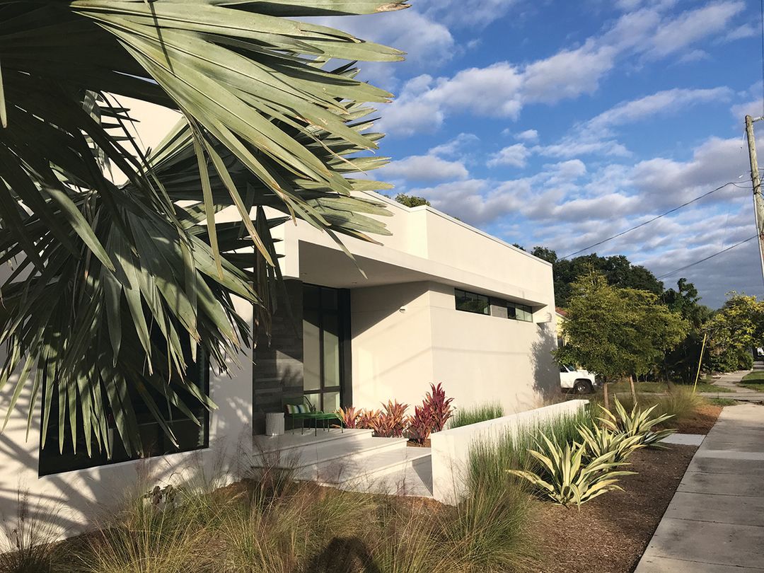 Balaity's minimalist home contrasts with older Florida Cracker cottages in this patchwork neighborhood.