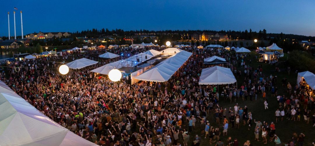 An image during the evening of the bend brewfest in bends old mill district. image courtesy of bend brewfest s8xhqd