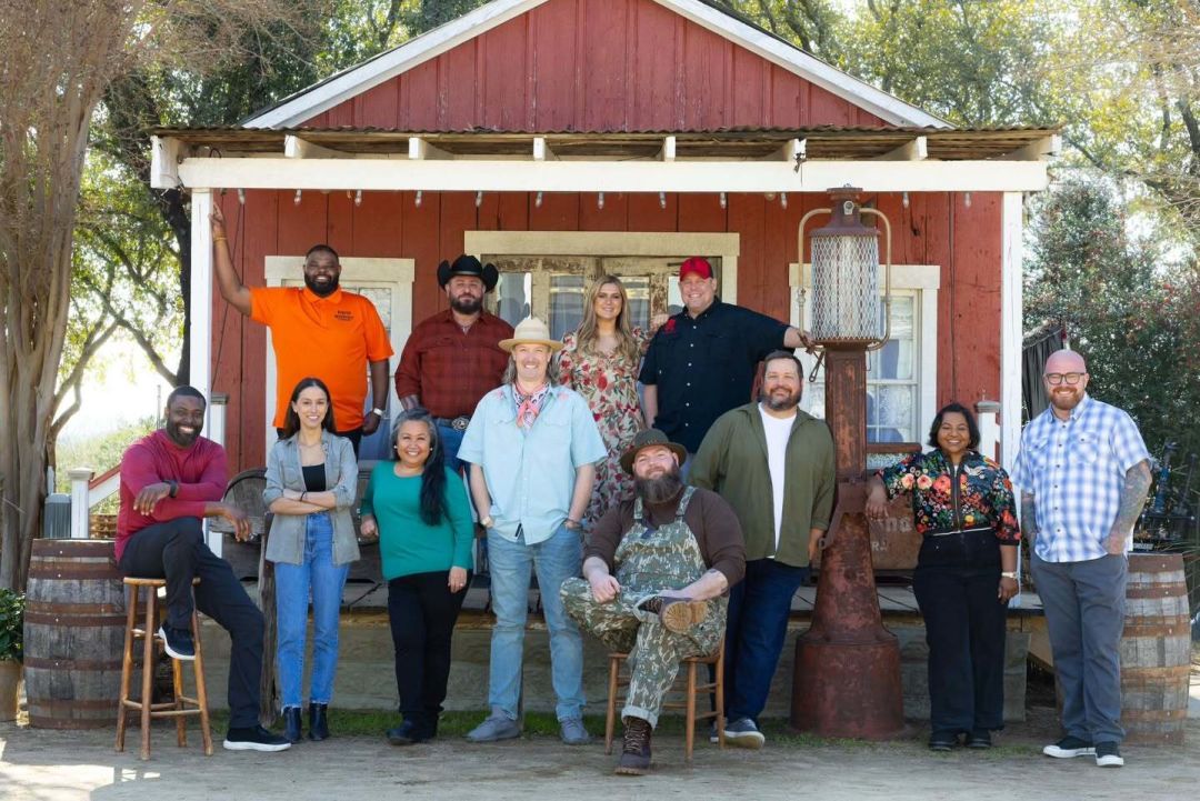 Greg Gatlin, left, sits with competitors on the set of BBQ Brawl.