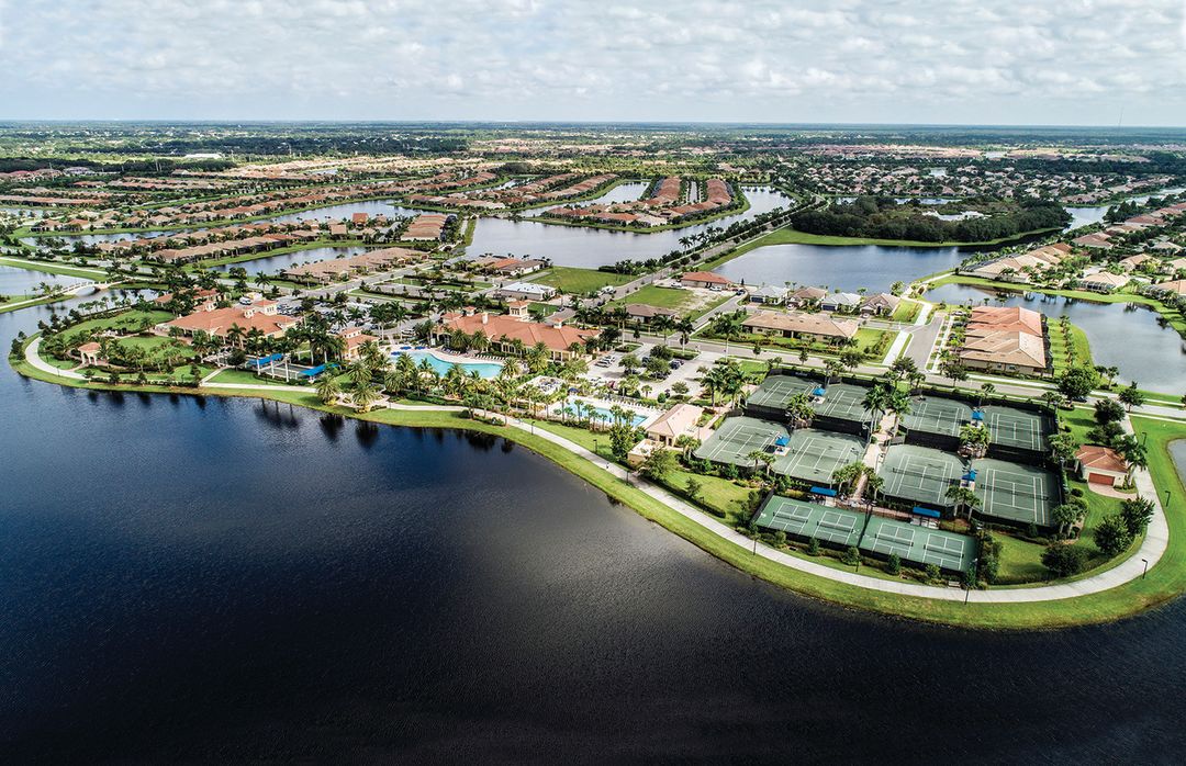 Island Walk is a gated community on 830 acres where homes are connected by canals, walking paths and bridges.