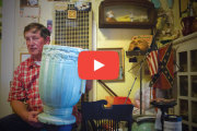 Doug Dreher, a barber shop owner in the Heights, represents the neighborhood’s vanishing artistic side.