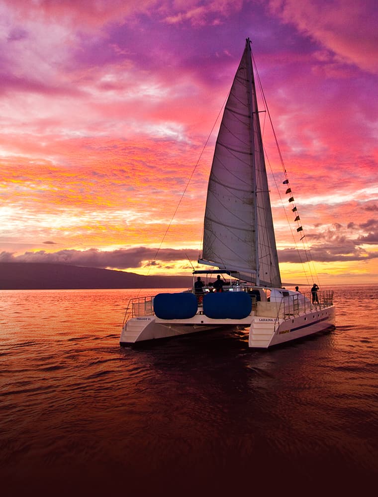 pink sunset with trilogy boat in foreground