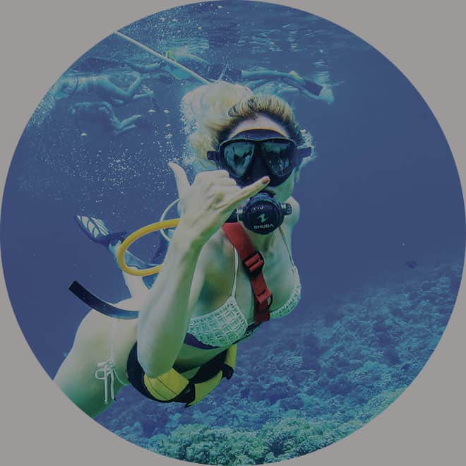 girl doing SNUBA underwater on trilogy snorkel sail