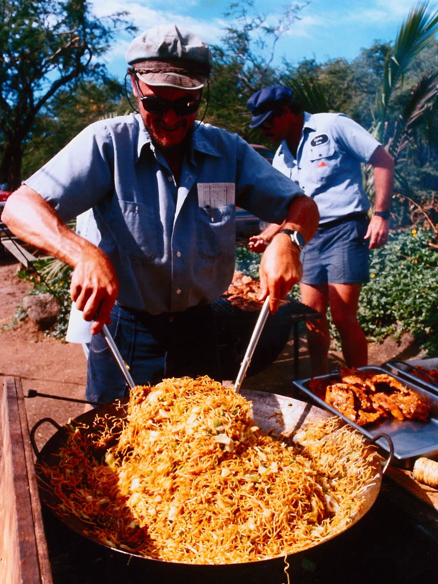 old photo of jim coon stirring soba noodles on Discover Lanai tour
