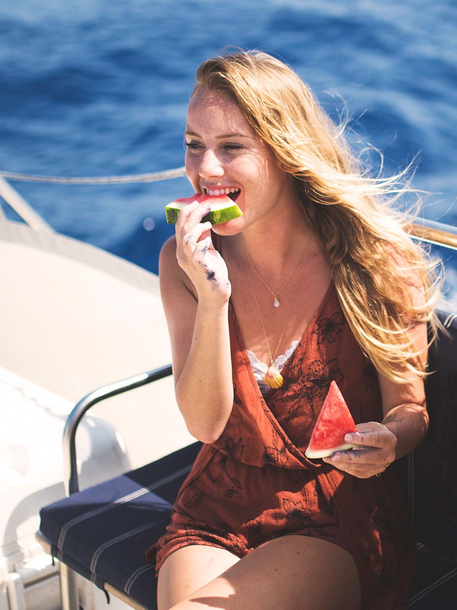 gallery7 girl eating watermelon on trilogy boat