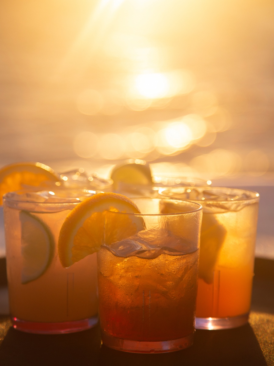 cocktails at sunset on the water, maui