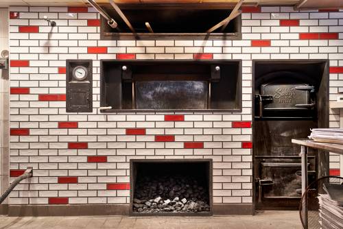 Pizza oven with white and red bricks