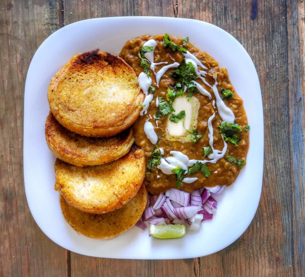 Pav Bhaji, an Indian street food with buttery toasted bread called Pav, eaten with spicy mashed vegetables