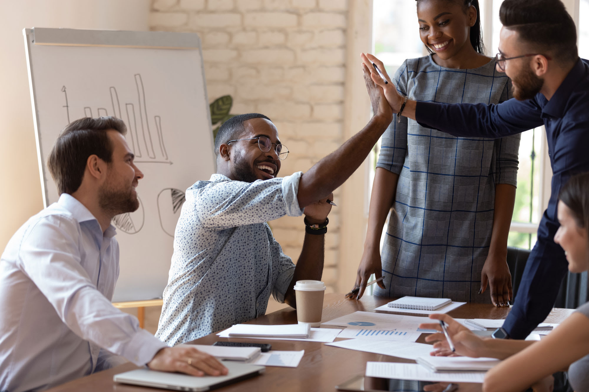 Apprentice managers in a meeting