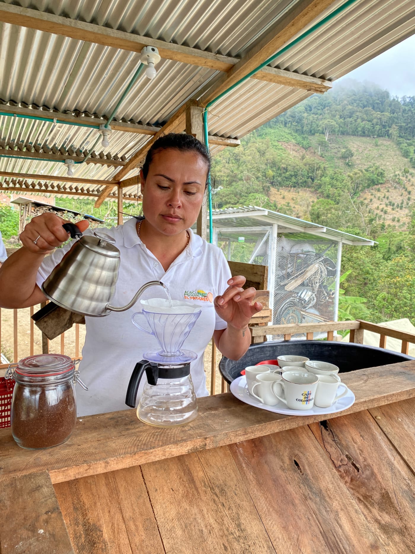 Adriana brewing coffee.