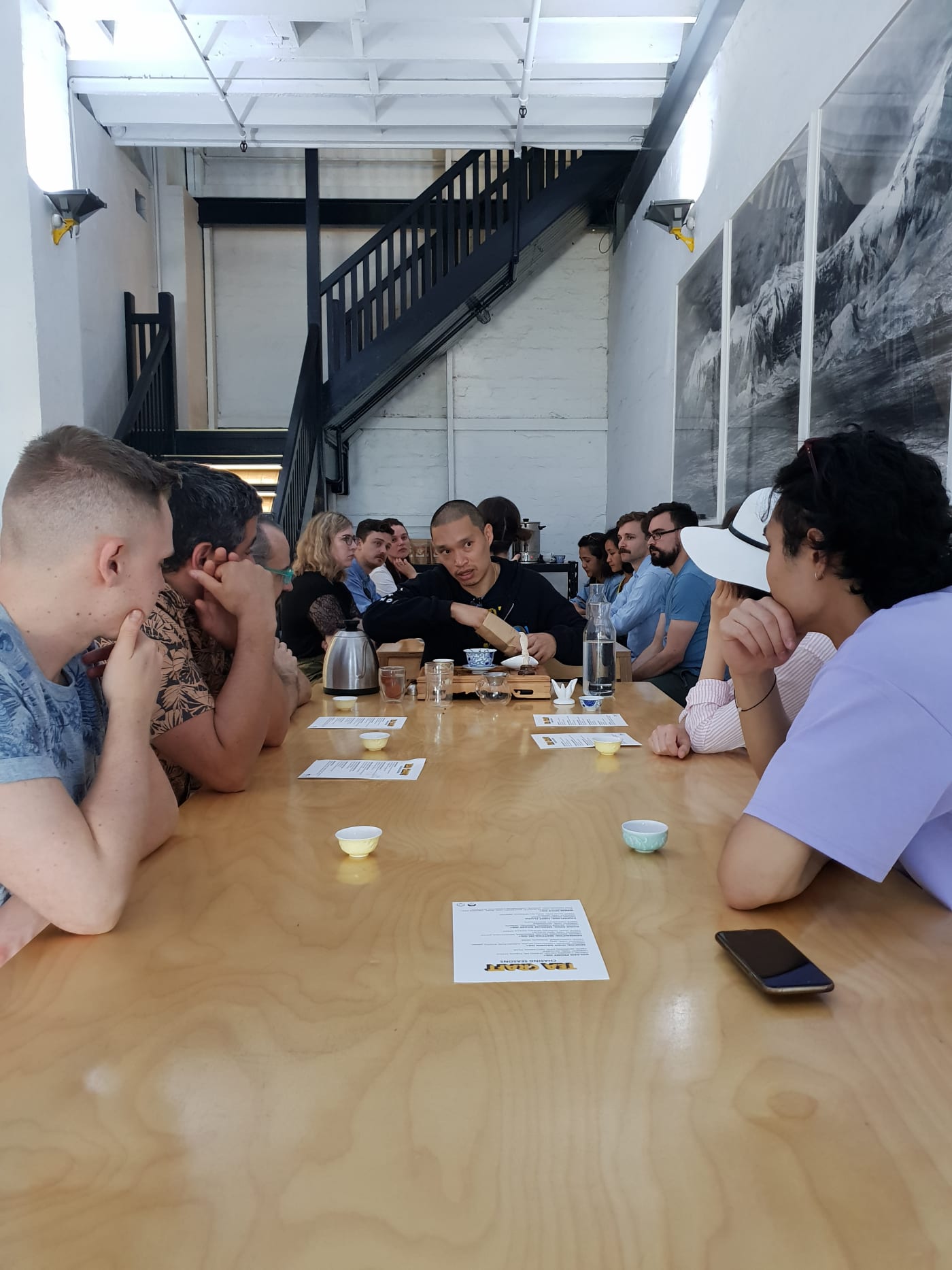A photo of a group of people participating in a tea tasting event in the Sample Coffee Pro Shop