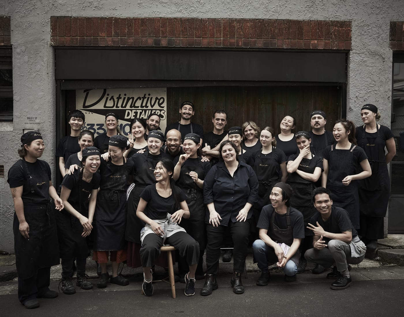 The Flour and Stone team posing together in work attire.