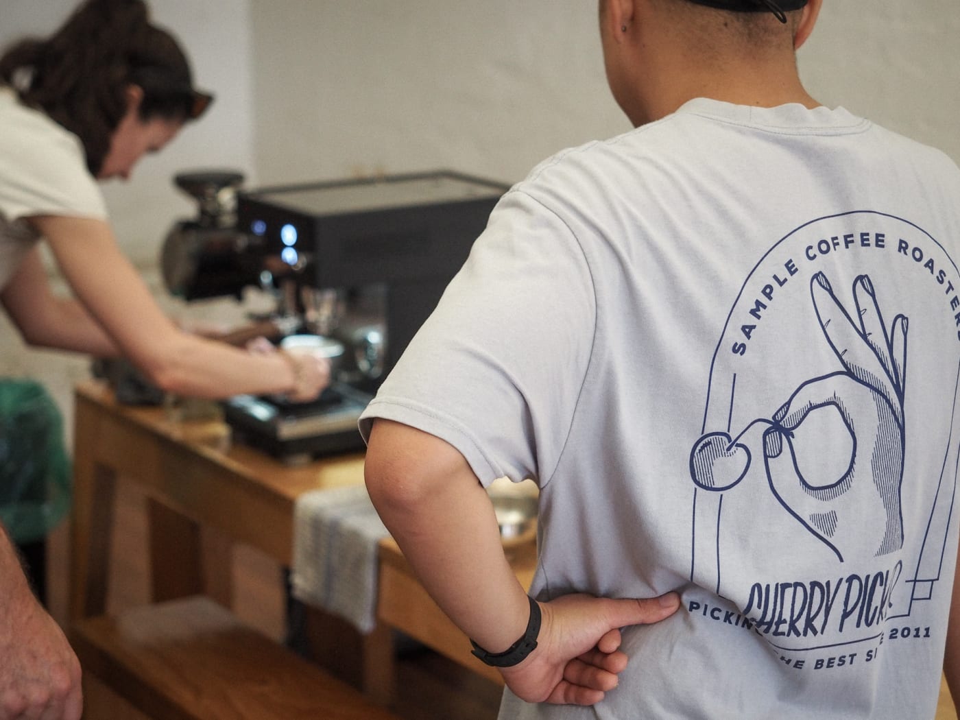 An attendee of our 1-on-1 workshop working in their espresso machine.