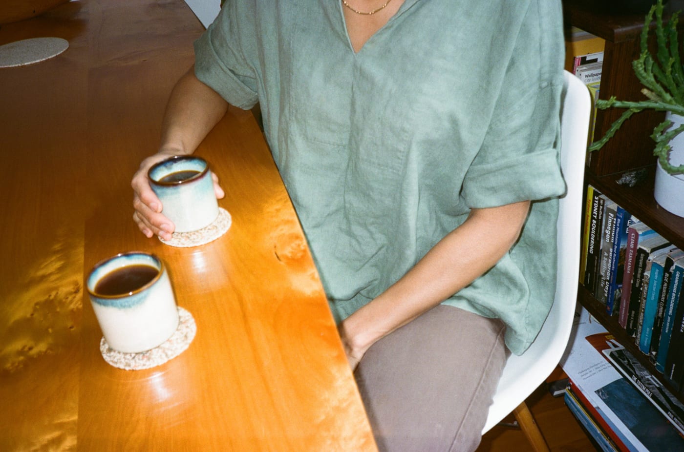 Sharing 2 cups filter coffee in a home dining table.