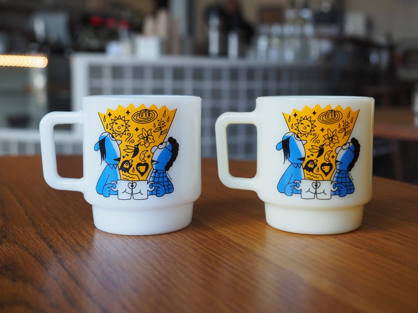 A pair of Sample Coffee x Jim Pluk mugs, view from the front.