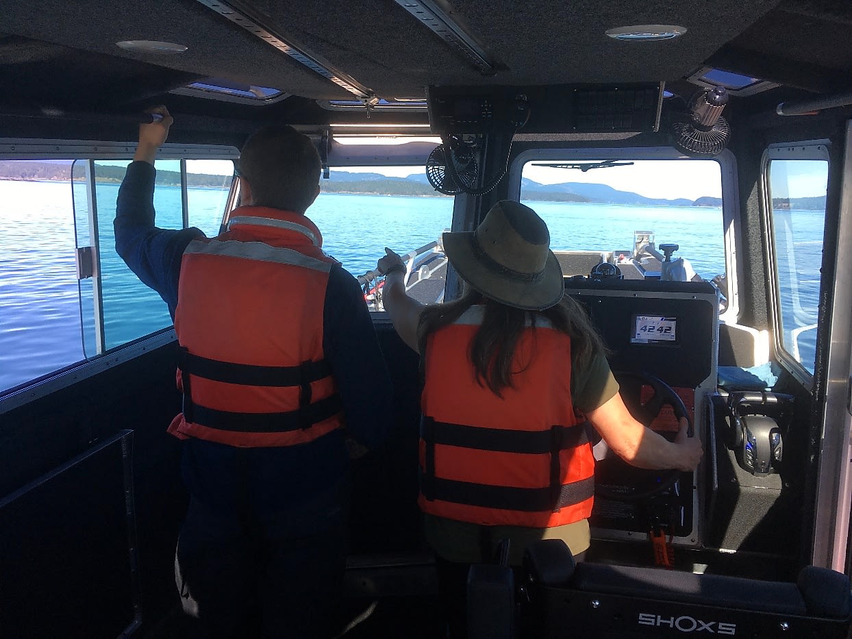 Marine crew operating Fireboat 31 from the pilothouse