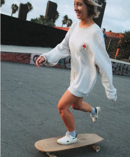 woman surfskating on a longboard