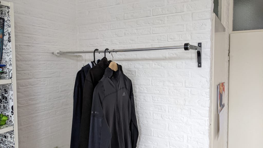 Clothes rack with clothes on it