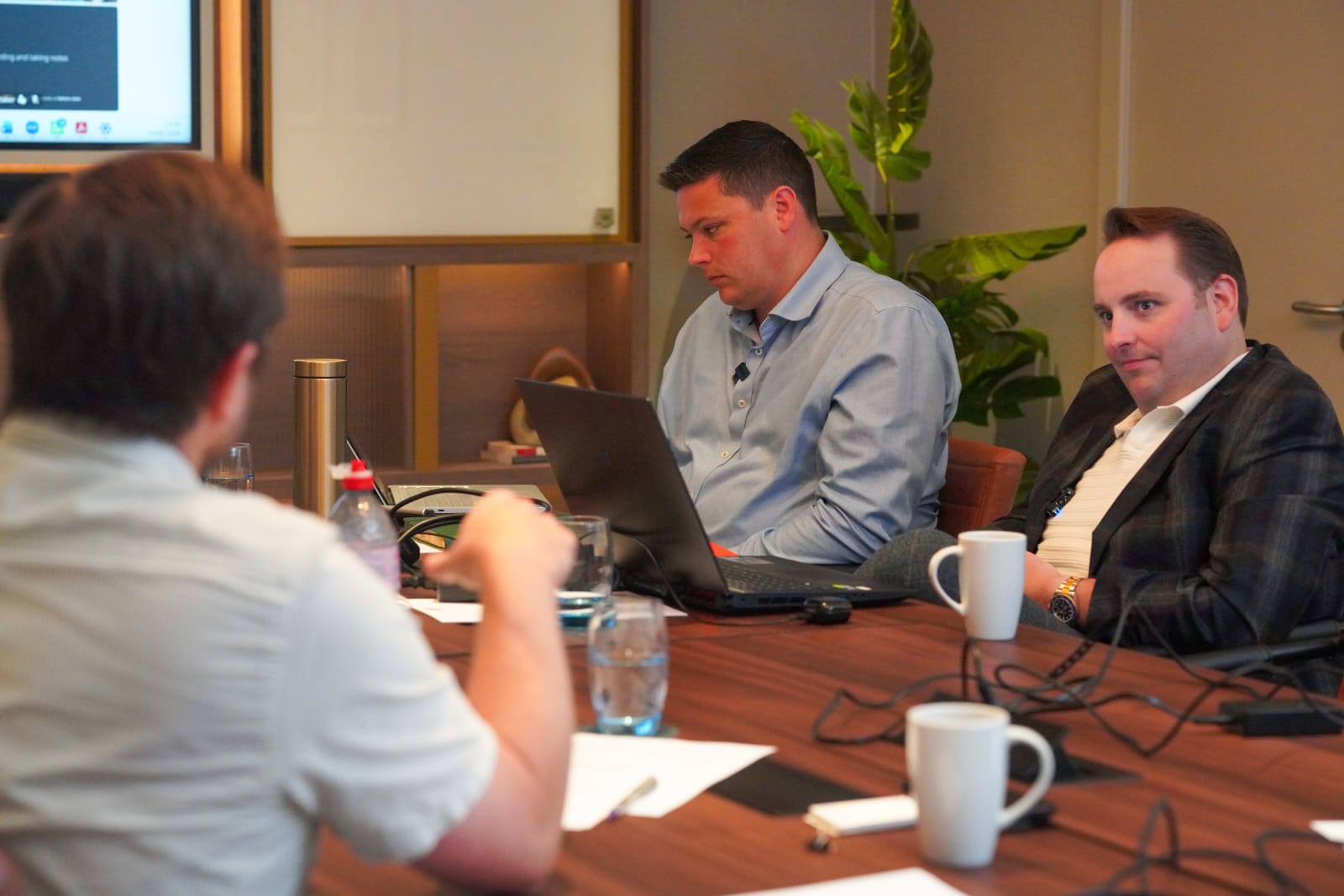 RISE specialists working through practical construction questions around a table