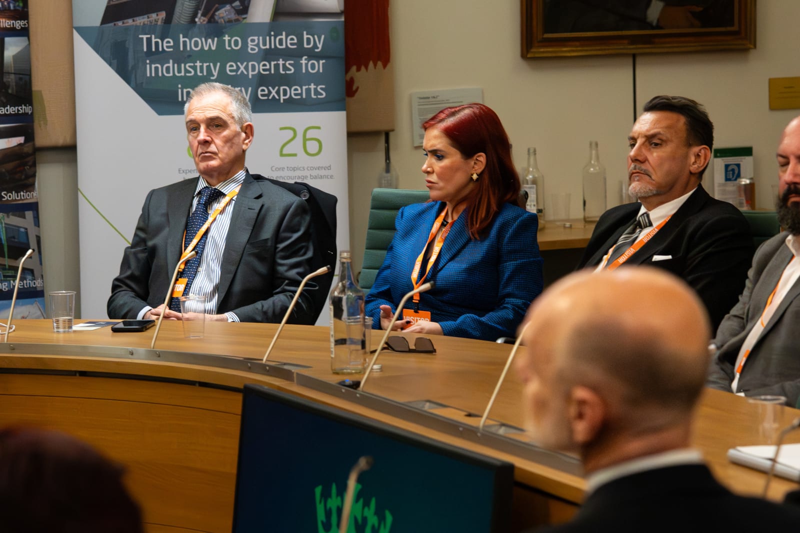 Panel participants listening during an industry task-force event at Parliament