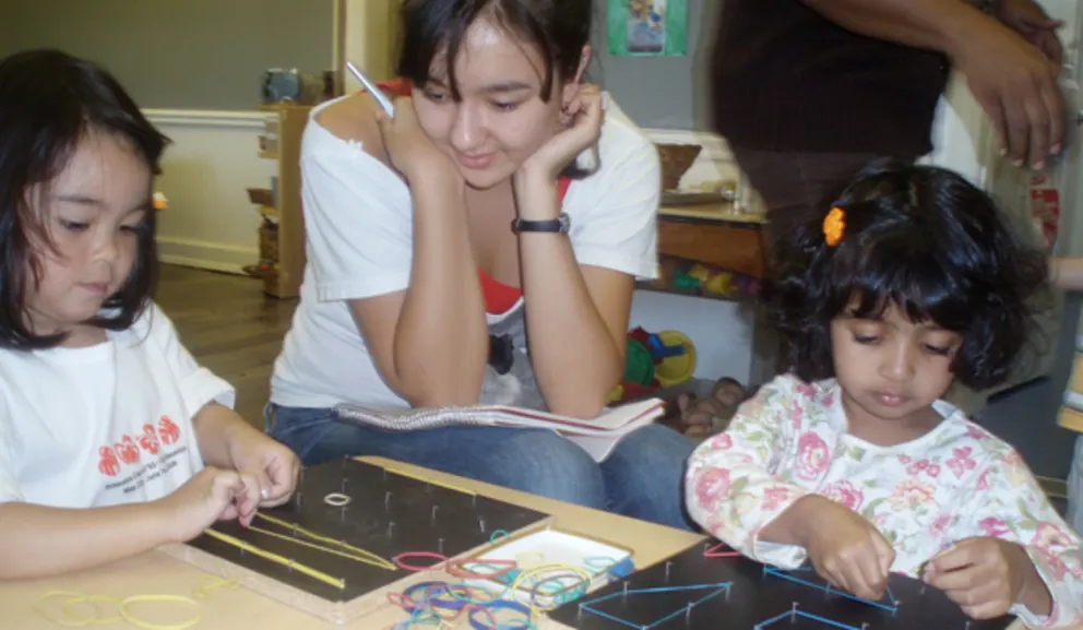 Three individuals engaged in a crafting activity with colorful materials on a table.