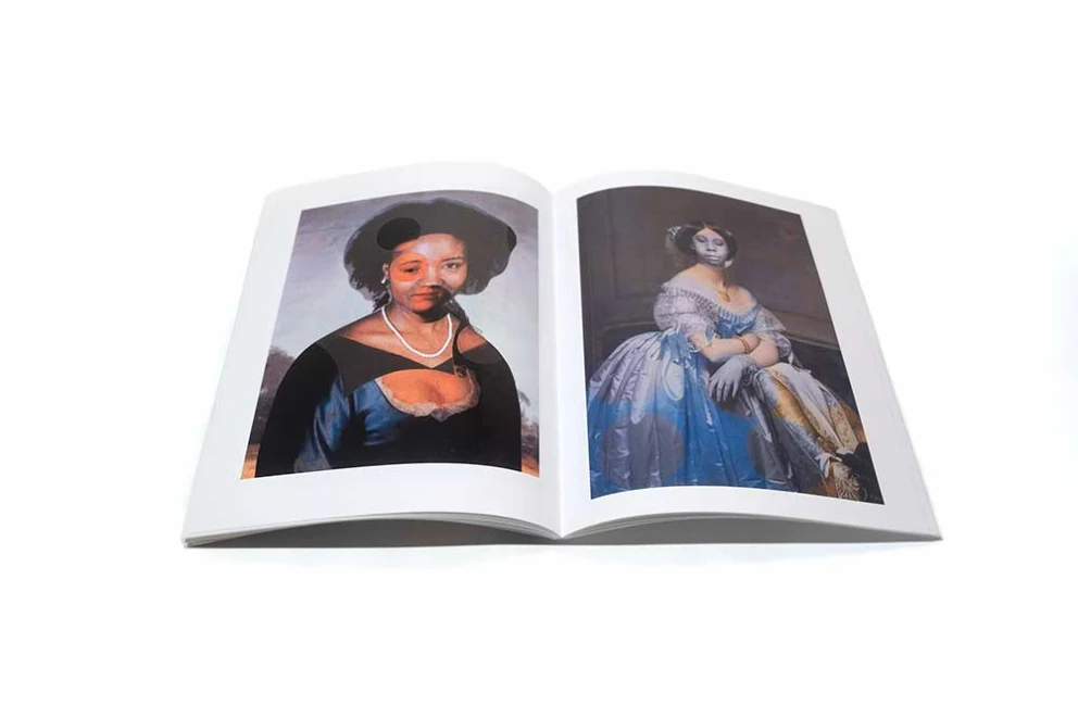 An open book displaying two classic portraits of women, one on each page, against a white background.