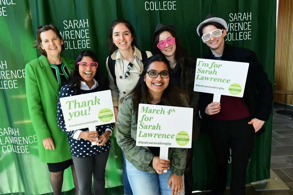 Group posing with fun glasses and signs supporting Sarah Lawrence College, including "Thank you!" and "March 4th for Sarah Lawrence."