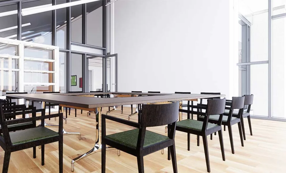Modern conference room with wooden flooring, a large rectangular table, and black chairs with green cushions. Floor-to-ceiling windows in the background.