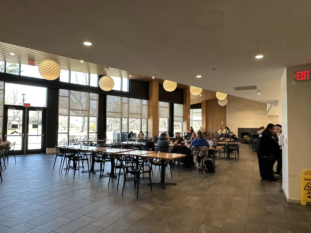 The Barbara Walters Campus Center Dining Pavilion with students eating at tables.