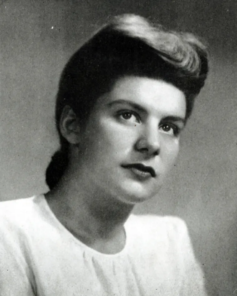 Vintage portrait of an individual with a voluminous hairstyle.