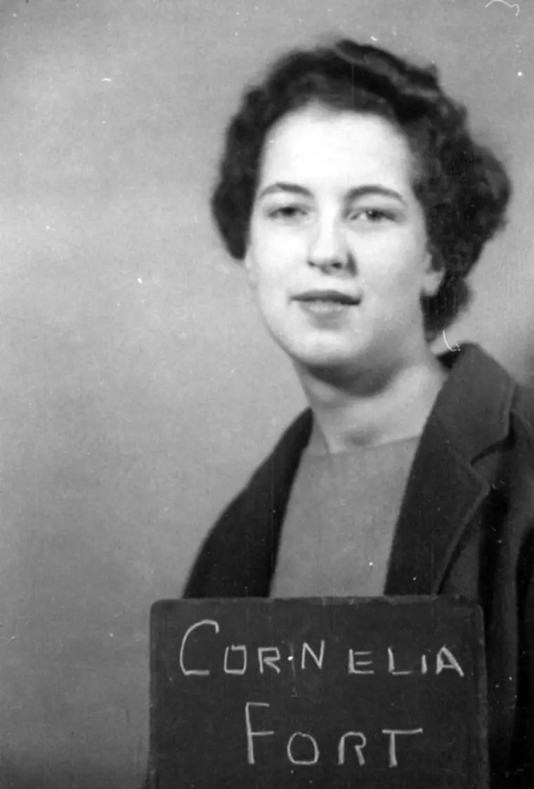 Vintage portrait of a person holding a sign with the name Cornelia Fort.