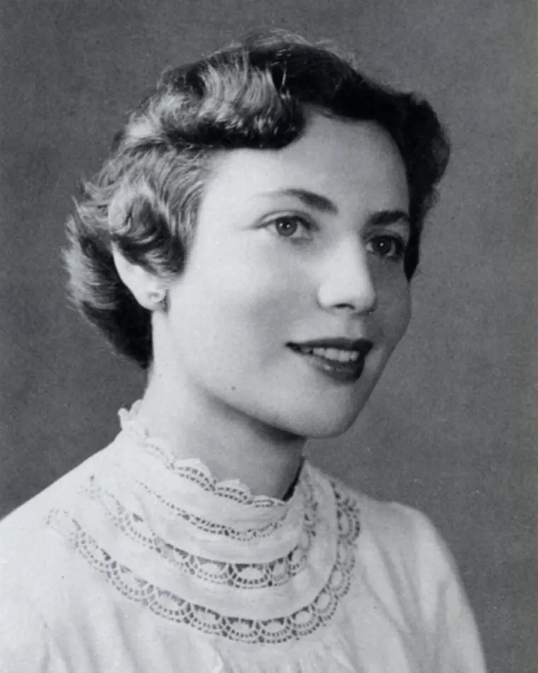 Black and white portrait of a person with a ruffled collar and a pleasant expression.
