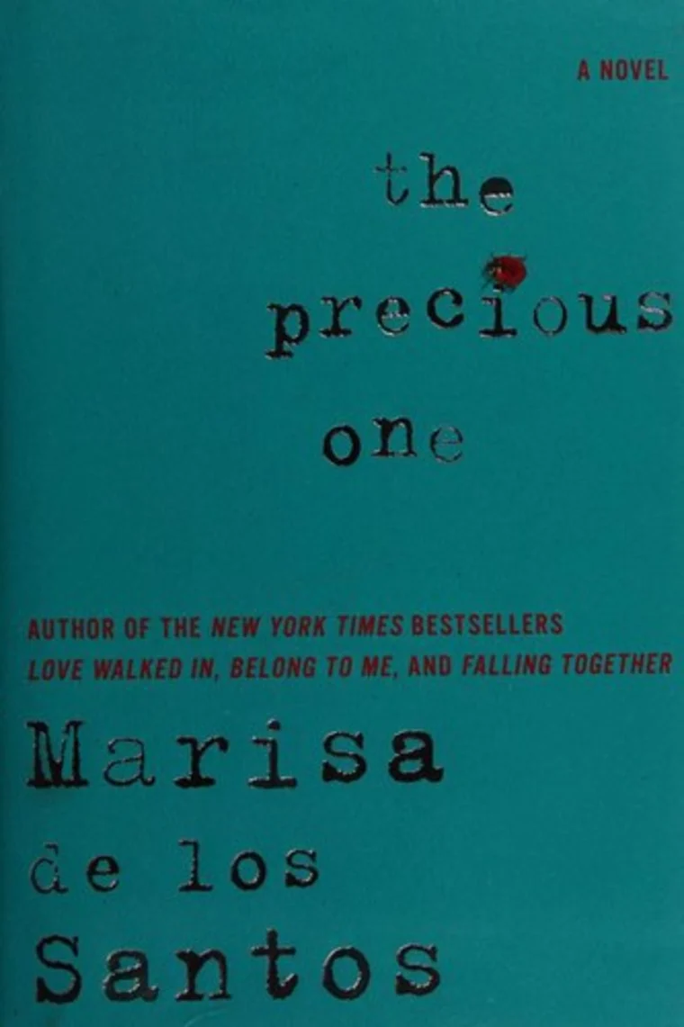 Teal book cover with title "The Precious One" and author Marisa de los Santos. Red text highlights author's previous bestsellers.