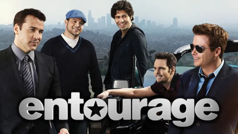 Five individuals standing together with a cityscape in the background, featuring the text "entourage" in large font at the bottom.