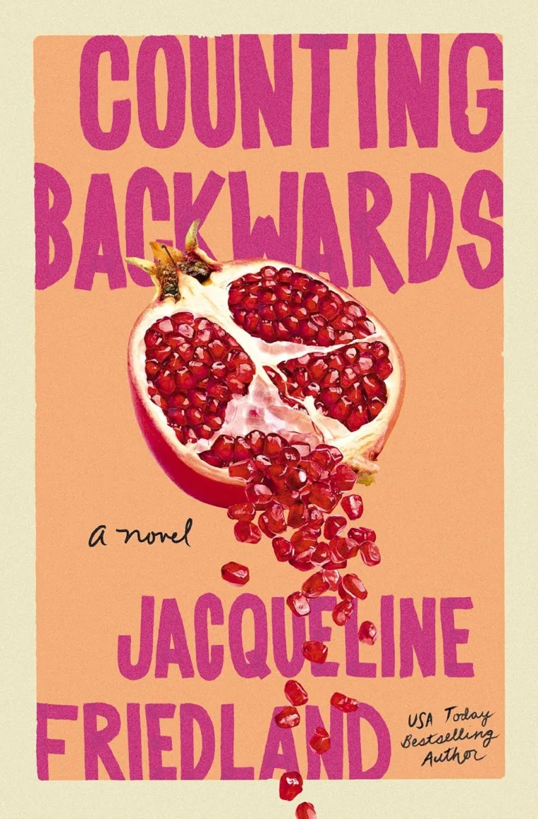 Book cover with a halved pomegranate spilling seeds. Title "Counting Backwards," author Jacqueline Friedland, USA Today bestselling author.